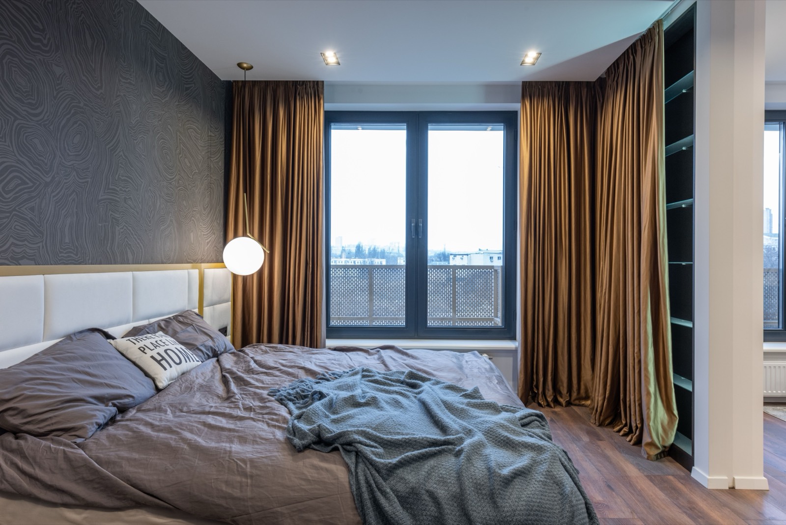 Blackout-lined curtains fitted in a bedroom window